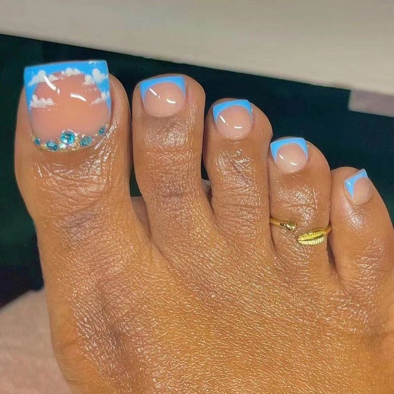 Toe nail blue sky french with blue diamonds